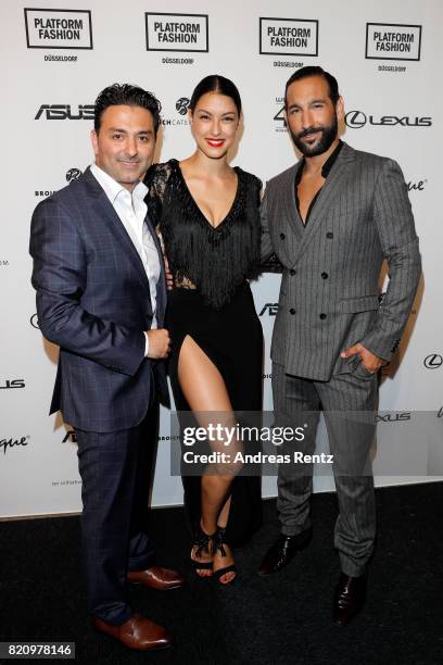 Of Unique Shahin Moghadam, Rebecca Mir and Massimo Senato attend the Unique after party during Platform Fashion July 2017 at Areal Boehler on July...