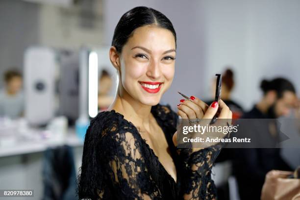 Rebecca Mir is seen backstage ahead of the Unique show during Platform Fashion July 2017 at Areal Boehler on July 22, 2017 in Duesseldorf, Germany.