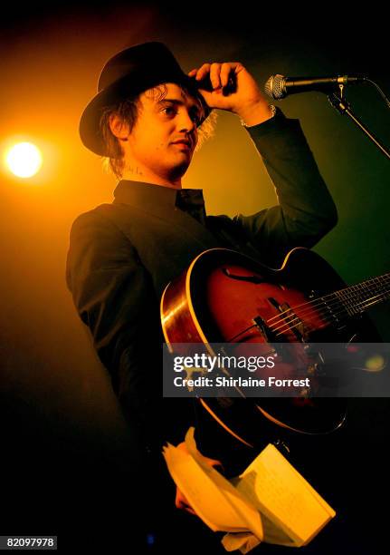 Pete Doherty holds fan mail while performing solo accoustic show at Manchester Academy on May 17, 2008 in Manchester, England.