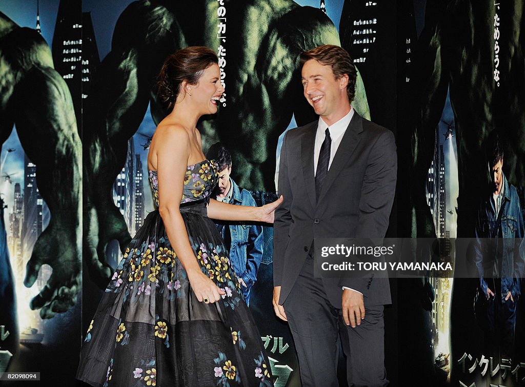 US actor Edward Norton (R) shares a ligh