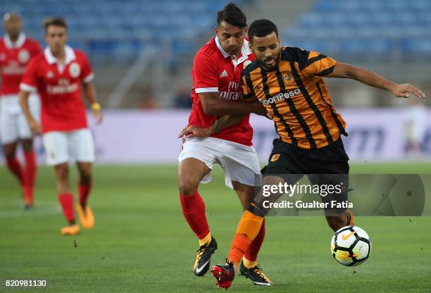Hull City midfielder Kevin Stewart with Benfica's midfielder Joao Carvalho from Portugal in action during the Algarve Cup match between SL Benfica...