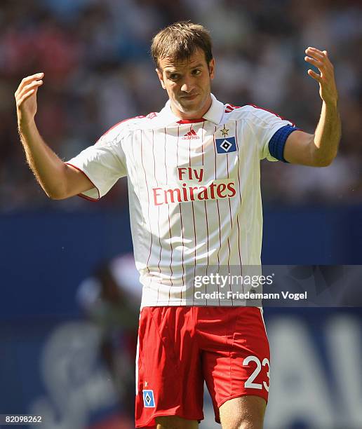 Rafael van der Vaart of Hamburg raises his hands during a pre season friendly match between Hamburger SV and Manchester City at the HSH Nordbank...