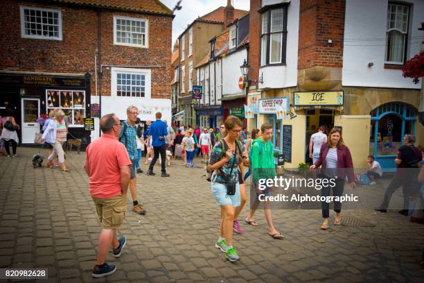 tourists and dog walkers in whitby - vlad vi stock pictures, royalty-free photos & images