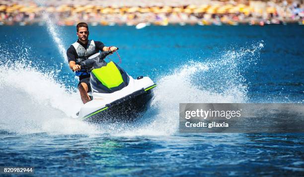 jet skiing. - speed boat stock pictures, royalty-free photos & images