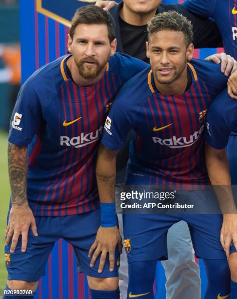Lionel Messi poses with Neymar before their International Champions Cup match between Juventus FC and FC Barcelona at the Met Life Stadium in East...