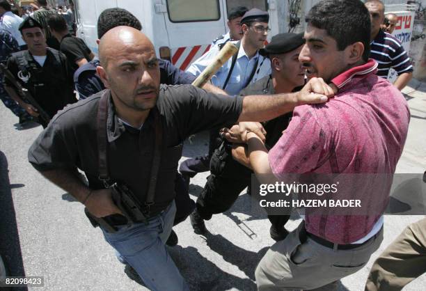 Palestinian security forces disperse demonstrators from Hizb al-Tahrir, a Palestinian political movement that calls for the return of an Islamic...