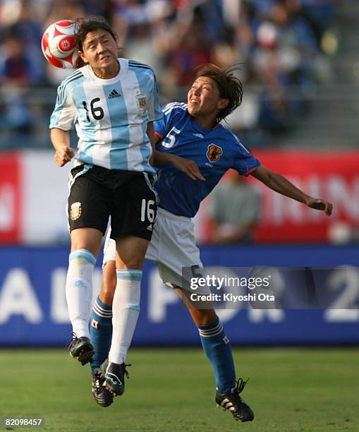 Maria Gimena Blanco of Argentina and Miyuki Yanagita of Japan fight the ball during the women's international friendly soccer match between Japan and...