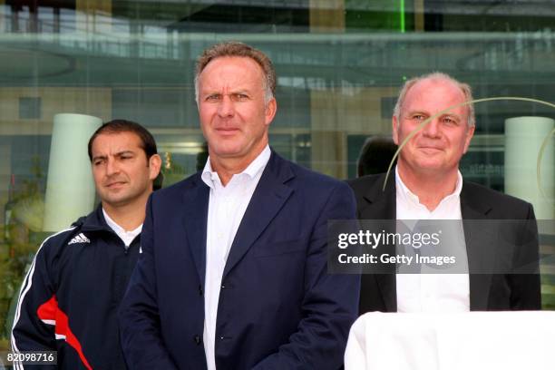 Karl-Heinz Rummenigge and manager Uli Hoeness of Bayern Muenchenlook on during the presentation of Bayern Muenchen's new cars made by Audi on July...