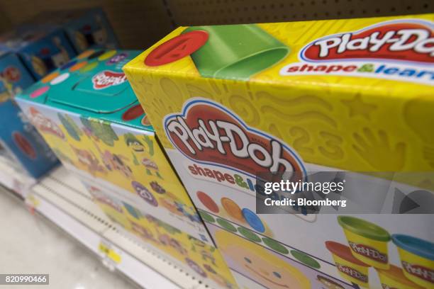 Hasbro Inc. Play-Doh brand modeling compound kits are displayed on a shelf at a Target Corp. Location in Emeryville, California, U.S., on Thursday,...