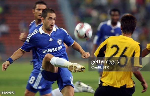 Chelsea footballer Joe Cole controls the ball during a friendly match between Chelsea and Malaysia at The Shah Alam Stadium on the outskirts of Kuala...