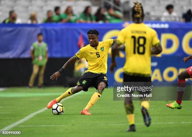 Alvas Powell of Jamaica passes the ball against Canada in a quarterfinal match during the CONCACAF Gold Cup at University of Phoenix Stadium on July...