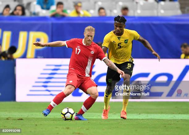Marcel de Jong of Canada controls the ball against Alvas Powell of Jamaica in a quarterfinal match during the CONCACAF Gold Cup at University of...