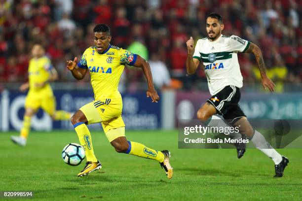 Orlando Berrio of Flamengo struggles for the ball with Luizao of Coritiba during a match between Flamengo and Coritiba as part of Brasileirao Series...