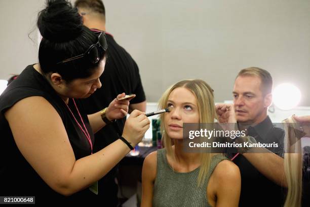 Model prepares backstage at SWIMMIAMI Gottex Cruise 2018 Fashion Show at WET Deck at W South Beach on July 22, 2017 in Miami Beach, Florida.