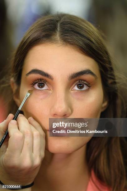 Model prepares backstage at SWIMMIAMI Gottex Cruise 2018 Fashion Show at WET Deck at W South Beach on July 22, 2017 in Miami Beach, Florida.