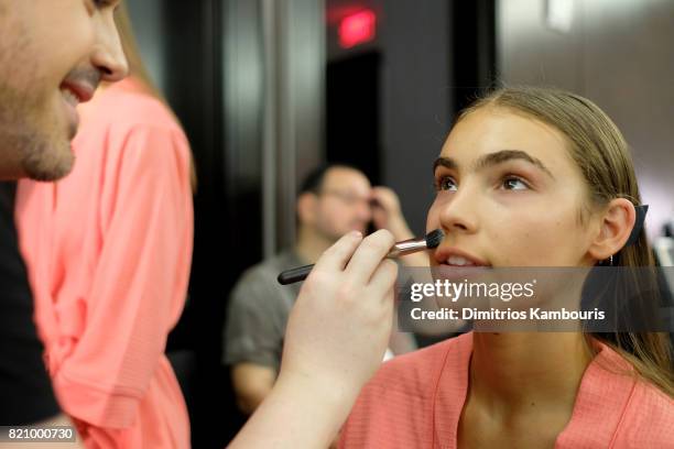 Model prepares backstage at SWIMMIAMI Gottex Cruise 2018 Fashion Show at WET Deck at W South Beach on July 22, 2017 in Miami Beach, Florida.