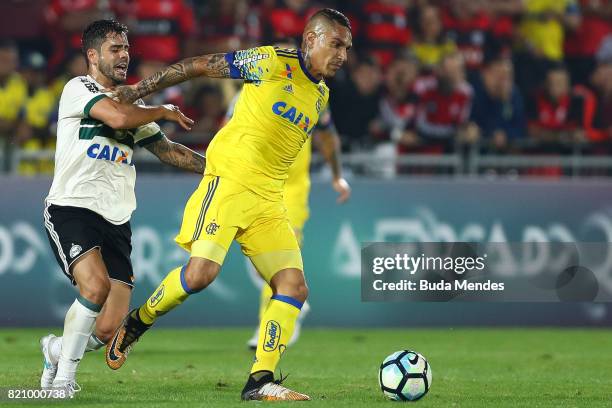 Paolo Guerrero of Flamengo struggles for the ball with Henrique Almeida of Coritiba during a match between Flamengo and Coritiba as part of...