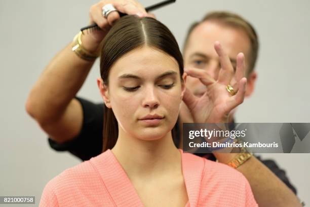 Model prepares backstage at SWIMMIAMI Gottex Cruise 2018 Fashion Show at WET Deck at W South Beach on July 22, 2017 in Miami Beach, Florida.