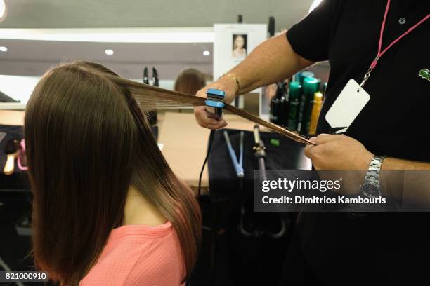 Model prepares backstage at SWIMMIAMI Gottex Cruise 2018 Fashion Show at WET Deck at W South Beach on July 22, 2017 in Miami Beach, Florida.