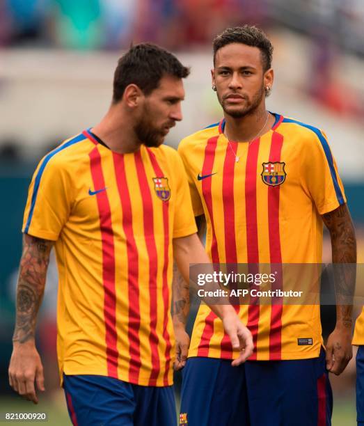 Neymar and Lionel Messi of FC Barcelona warm up before the International Champions Cup match between Juventus FC and FC Barcelona at the Met Life...