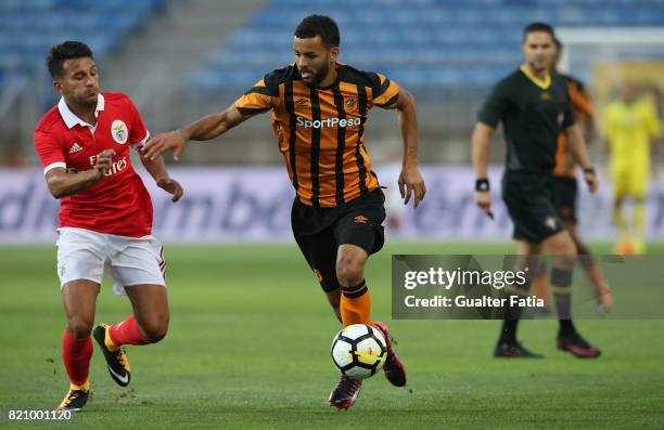 Hull City midfielder Kevin Stewart with Benfica's midfielder Joao Carvalho from Portugal in action during the Algarve Cup match between SL Benfica...