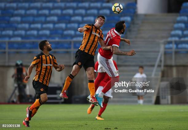 Hull City midfielder Daniel Batty with Benfica's forward Kostas Mitroglou from Greece in action during the Algarve Cup match between SL Benfica and...