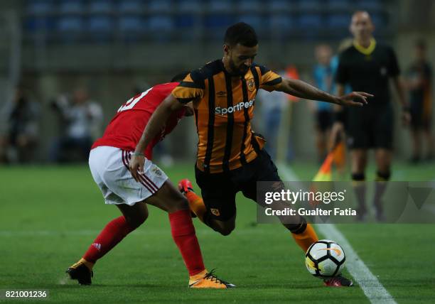 Hull City midfielder Kevin Stewart with Benfica's midfielder Joao Carvalho from Portugal in action during the Algarve Cup match between SL Benfica...