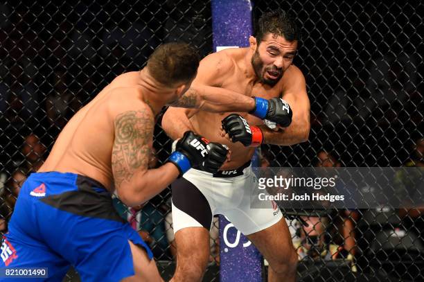 Eryk Anders punches Rafael Natal of Brazil in their middleweight bout during the UFC Fight Night event inside the Nassau Veterans Memorial Coliseum...