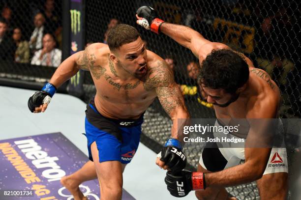 Eryk Anders punches Rafael Natal of Brazil in their middleweight bout during the UFC Fight Night event inside the Nassau Veterans Memorial Coliseum...