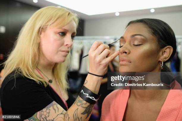 Model prepares backstage at SWIMMIAMI Gottex Cruise 2018 Fashion Show at WET Deck at W South Beach on July 22, 2017 in Miami Beach, Florida.