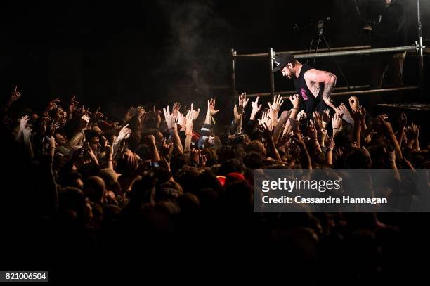 Ben Thatcher of the band Royal Blood jumps into the crowd during Splendour in the Grass 2017 on July 22, 2017 in Byron Bay, Australia.