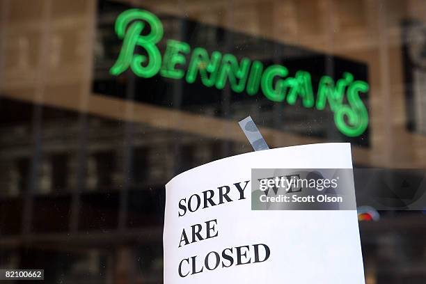 Closed sign hangs on the door of a Bennigan's Grill & Tavern restaurant July 29, 2008 in downtown Chicago, Illinois. The corporation that owns...
