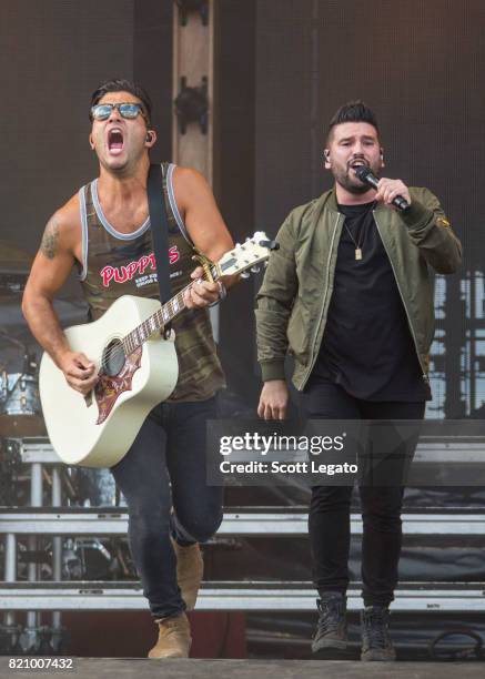 Dan Smyers and Shay Mooney of Dan + Shay perform during day 2 of Faster Horses Festival at Michigan International Speedway on July 22, 2017 in...