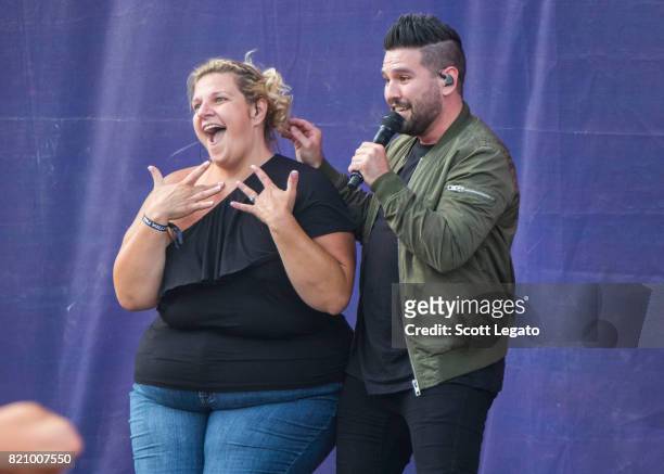 Sign language translator Shay Mooney of Dan + Shay performs during day 2 of Faster Horses Festival at Michigan International Speedway on July 22,...