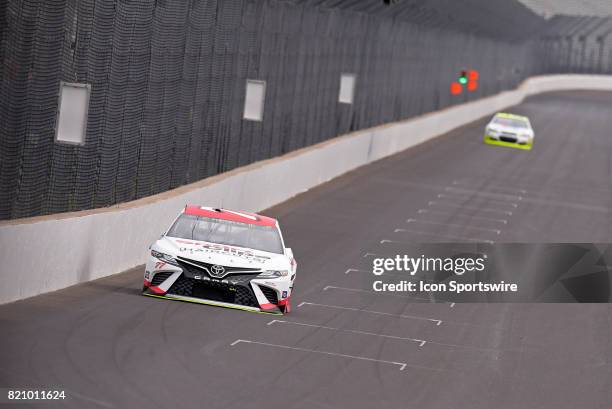 Erik Jones Furniture Row Racing Toyota Camry drives down the front stretch during practice for the NASCAR Monster Energy Cup Series Brantley Gilbert...