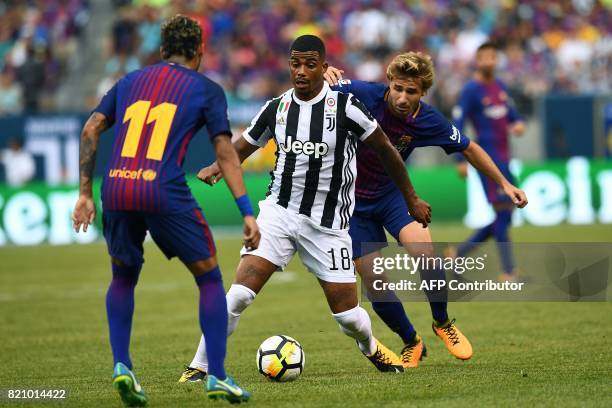 Juventus' midfielder from France Mario Lemina vies for the ball with Barcelona's Brazilian forward Neymar during the International Champions Cup...