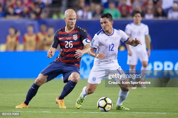 United States midfielder Michael Bradley battles with El Salvador midfielder Narcisco Orellana for the ball during a CONCACAF Gold Cup Quarterfinal...