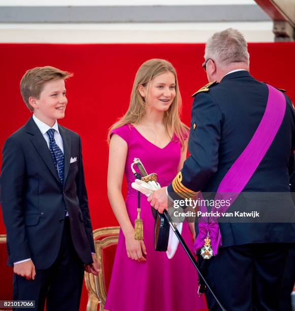 Princess Elisabeth of Belgium, Prince Gabriel of Belgium and Prince Laurent of Belgium attend the military parade on the occasion of the Belgian...