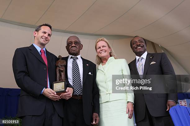 To R: National Baseball Hall of Fame President Jeff Idelson, Warren O'Neill, National Baseball Hall of Fame Chairman Jane Clark and Joe Morgan during...