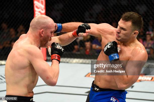 Gian Villante punches Patrick Cummins in their light heavyweight bout during the UFC Fight Night event inside the Nassau Veterans Memorial Coliseum...