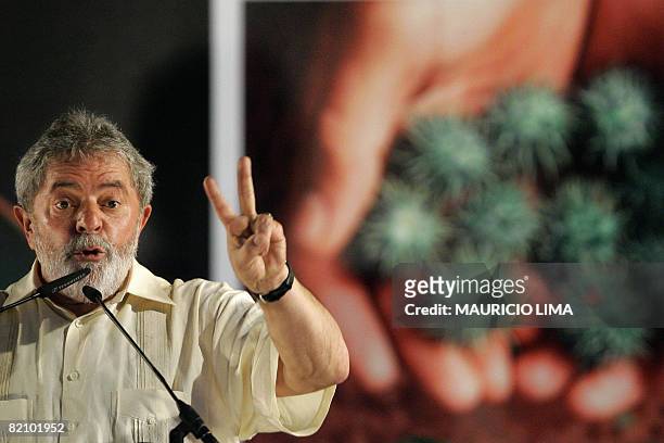 Brazil's President Luiz Inacio Lula da Silva gestures as he delivers a speech during the inauguration of the first biofuel production plant, at...