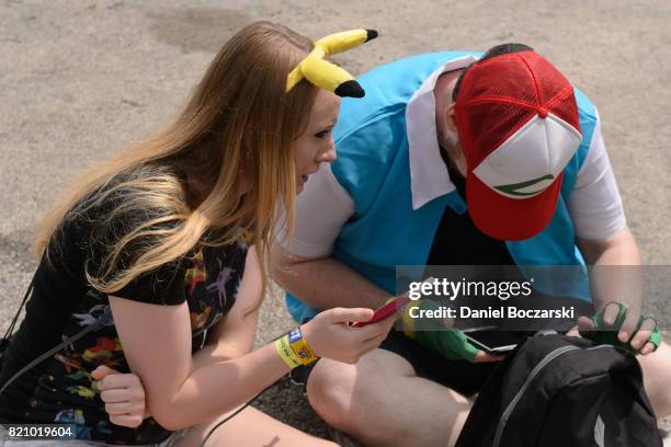 Attendees in Pokemon cosplay attend the Pokemon GO Fest at Grant Park on July 22, 2017 in Chicago, Illinois.