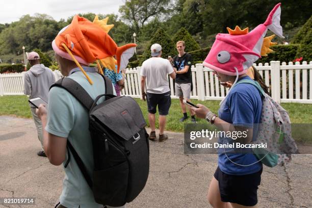 Attendees in Pokemon cosplay attend the Pokemon GO Fest at Grant Park on July 22, 2017 in Chicago, Illinois.