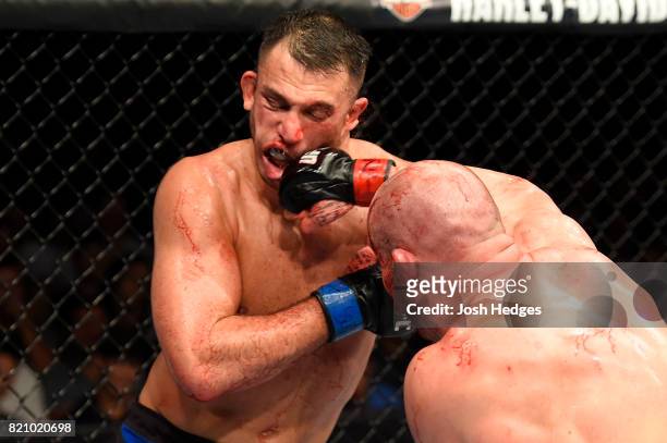 Patrick Cummins punches Gian Villante in their light heavyweight bout during the UFC Fight Night event inside the Nassau Veterans Memorial Coliseum...
