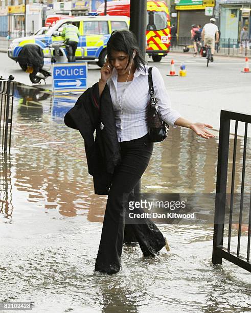 Burst water main causes chaos for evening commuters on July 30, 2008 in London, England. The burst main meant police and fire crews had to close off...