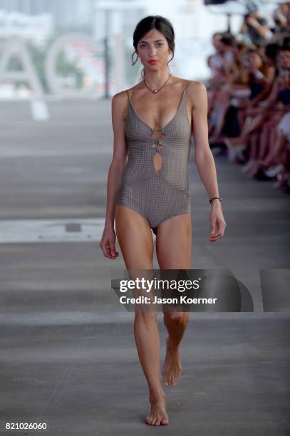 Model walks the runway at ACACIA fashion show during FUNKSHION Swim Fashion Week at 1111 Lincoln Road on July 22, 2017 in Miami, Florida.