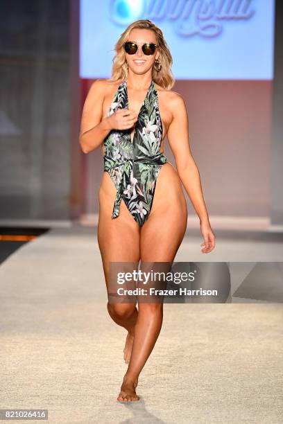 Camille Kostek walks the runway during SWIMMIAMI Sports Illustrated Swimsuit 2018 Collection at WET Deck at W South Beach on July 22, 2017 in Miami...