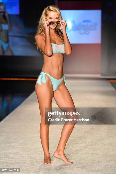 Model walks the runway during SWIMMIAMI Sports Illustrated Swimsuit 2018 Collection at WET Deck at W South Beach on July 22, 2017 in Miami Beach,...