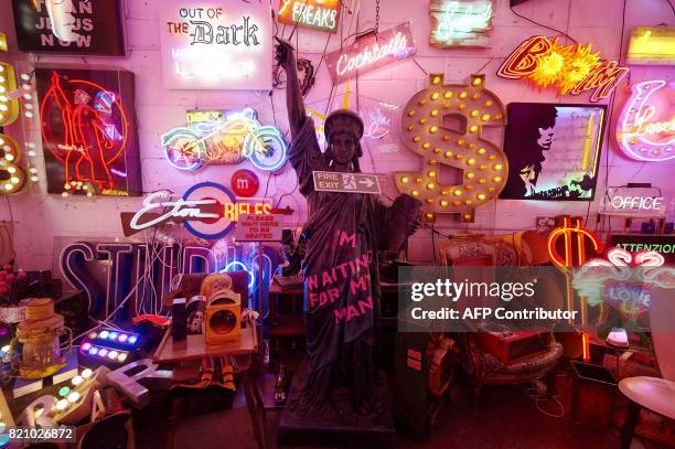 An array of neon lights and signs are displayed inside God's Own Junkyard gallery, cafe and workshop in Walthamstow, east London on July 8, 2017....