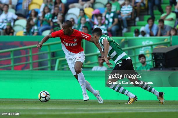 Monaco midfielder Fabinho from Brasil tries to escape Sporting CP midfielder Rodrigo Battaglia from Argentina during the Friendly match between...